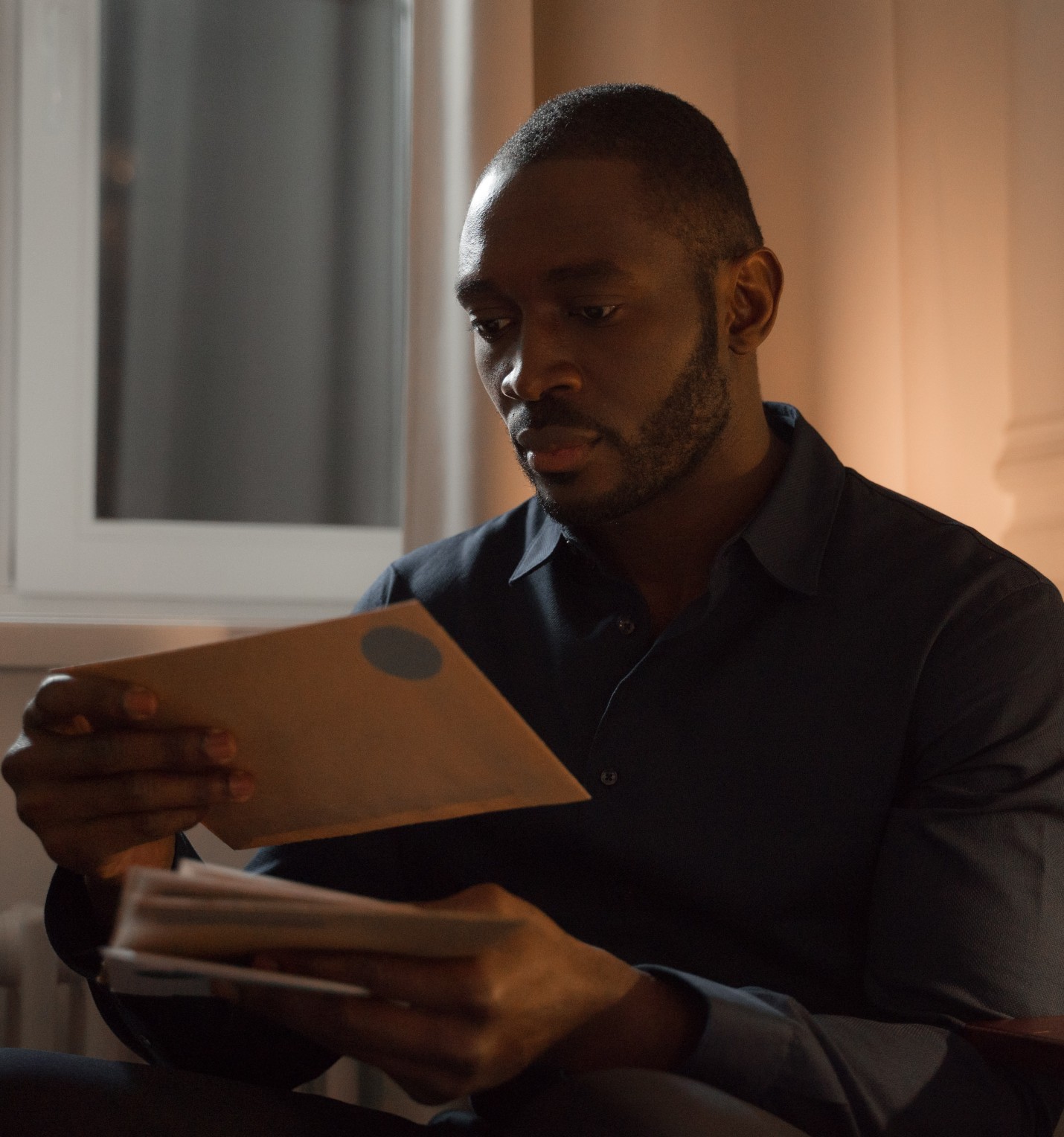 Man opening Minded to Bar letter